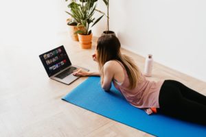 Lady researching health and fitness on laptop