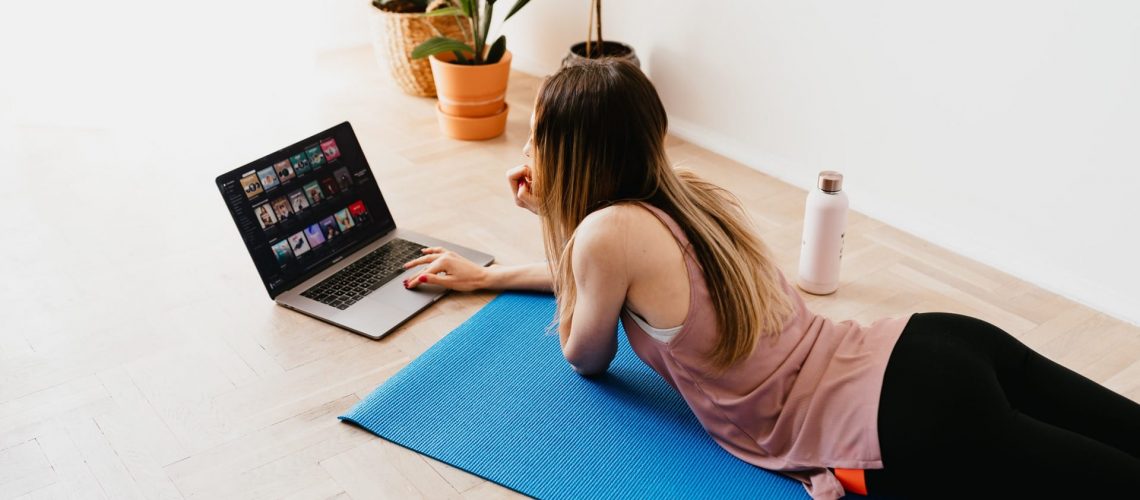 Lady researching health and fitness on laptop